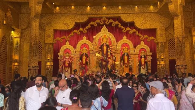 Devotees Celebrating Durga Puja Festival in a Golden Pandal