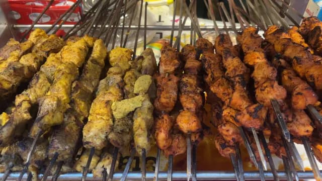 Assorted Grilled Meat Skewers at a Street Food Stall