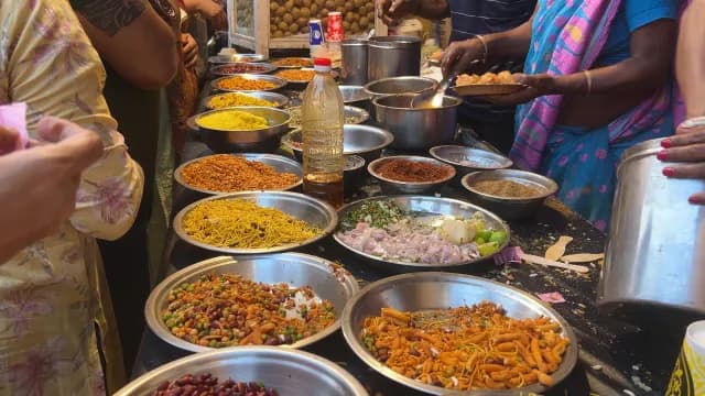 Indian Street Food Vendor Preparing Traditional Chaat and Panipuri