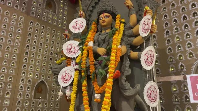 Ornate Goddess Durga Statue Adorned with Garlands During Durga Puja Festival
