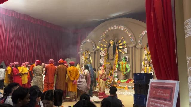 Devotees Gather for Durga Puja Festival Rituals in a Decorated Pandal