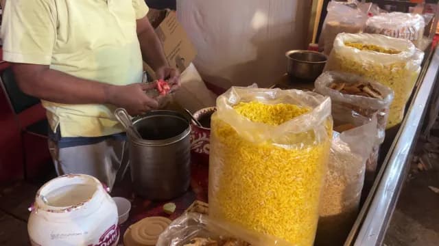Indian Street Food Vendor Preparing Traditional Spicy Bhel Puri Snack