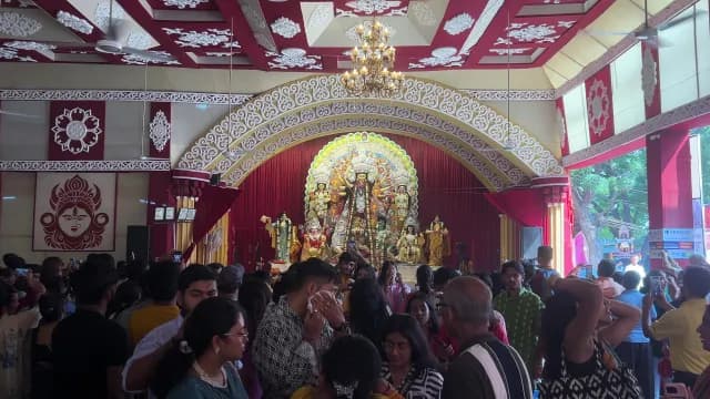 Devotees Celebrating Durga Puja Festival at a Decorated Pandal in Delhi