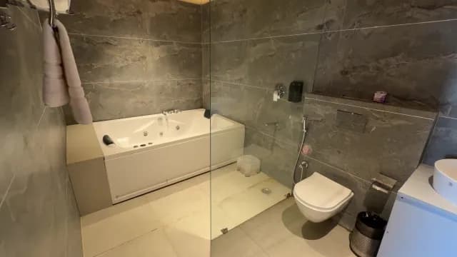 Modern Luxury Bathroom Interior with Whirlpool Bathtub and Marble Tiles