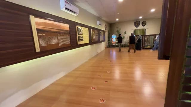 Visitors Exploring Jim Corbett Tiger Reserve Museum Exhibit in Uttarakhand