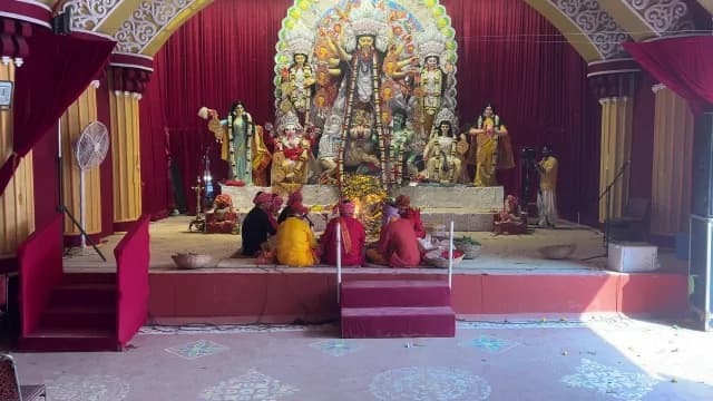 Traditional Durga Puja Rituals and Idols in a Decorated Pandal